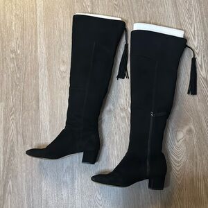 Over the knee suede black boots with fun tassel on the back as a zipper